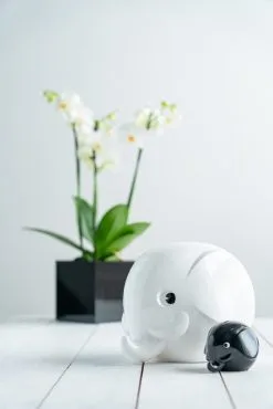 Palaset Medi Elephant Moneybox, Black -Fredericia Sales White and black elephant on the table highr